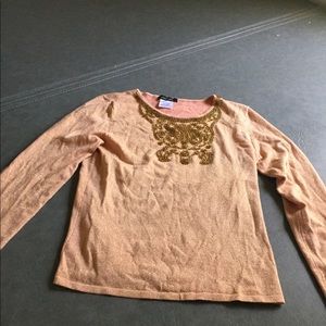 Orange beaded sweater shirt with gold color